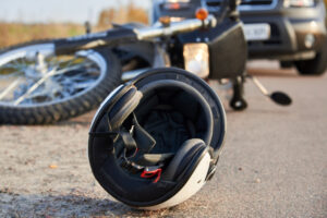 A helmet on the ground after a motorcycle crash. Can I sue if I wasn’t wearing a helmet during a motorcycle accident?