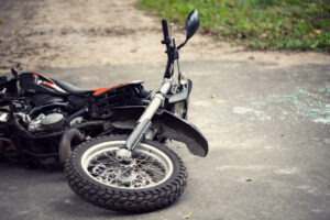 A crashed motorcycle on the side of the road. What are my rights after a motorcycle crash in WA?